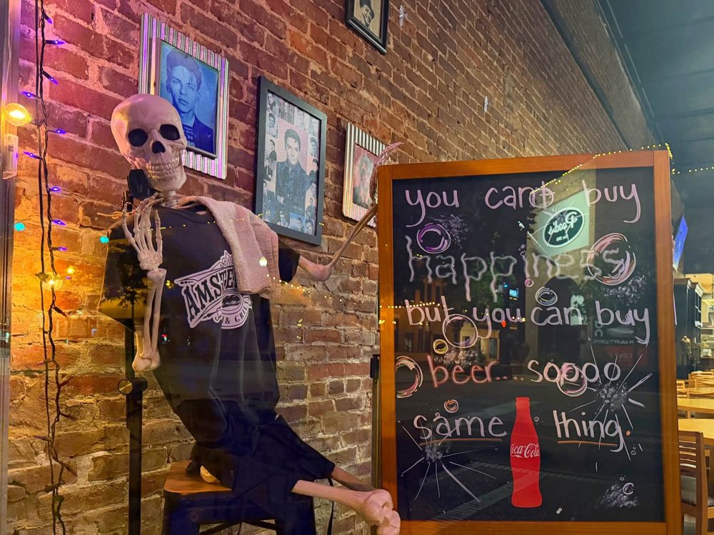 Window display with skeleton and chalkboard